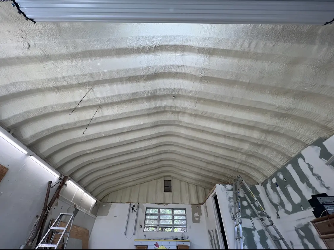 Spray polyurethane foam applied to the underside of a metal roof deck in Wilmington Manor